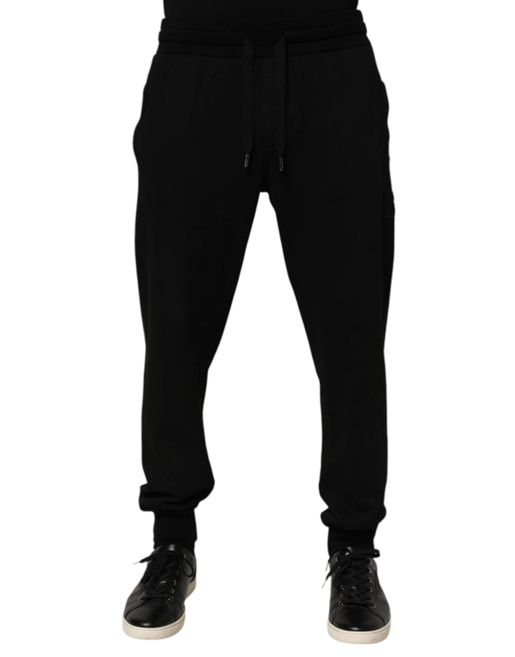 Pantalon jogger homme Dolce & Gabbana en coton noir avec logo DG, style décontracté et moderne.