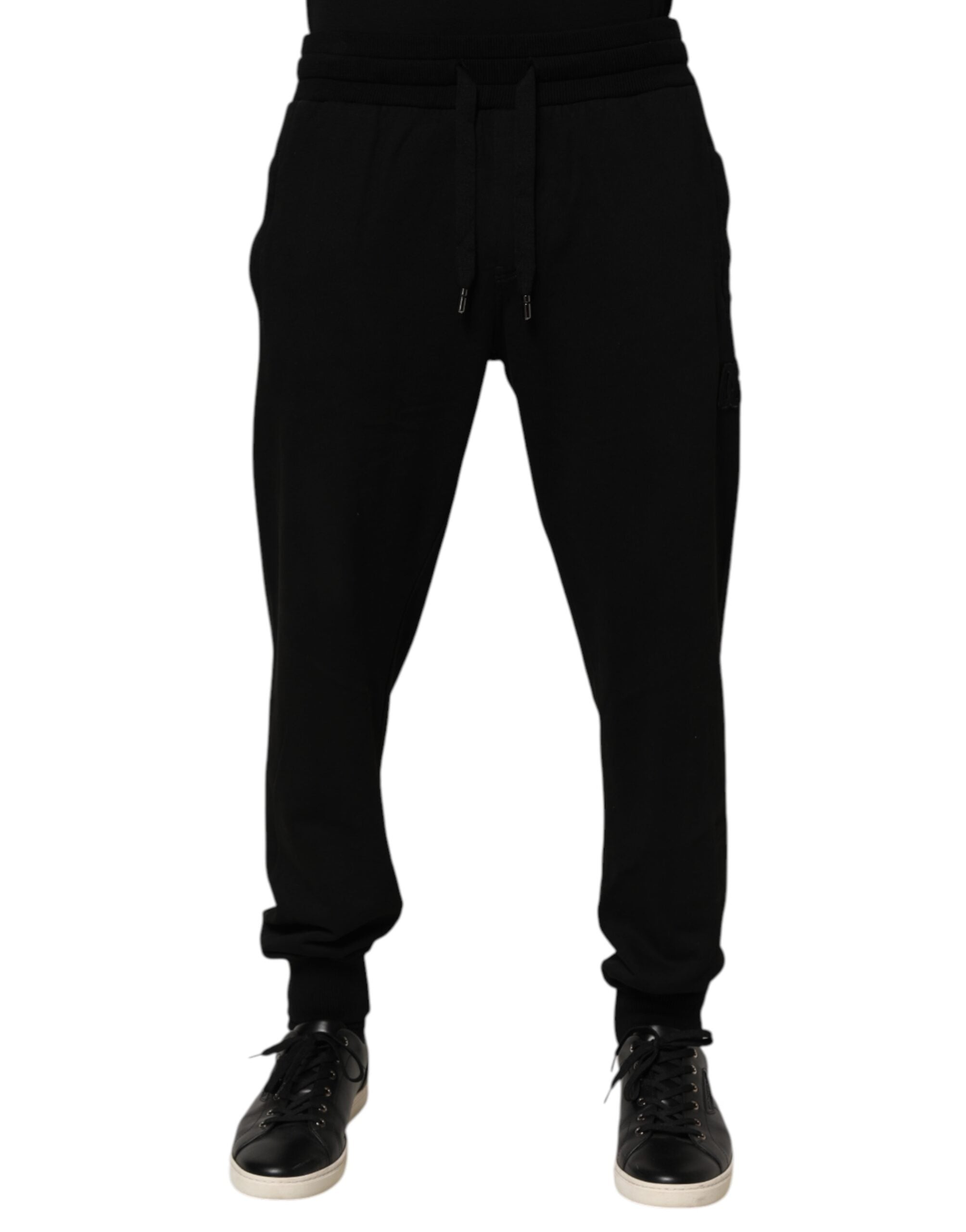 Pantalon jogger homme Dolce & Gabbana en coton noir avec logo DG, style décontracté et moderne.