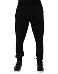 Pantalons jogger pour homme Dolce & Gabbana en coton noir avec logo DG, style décontracté et confortable.
