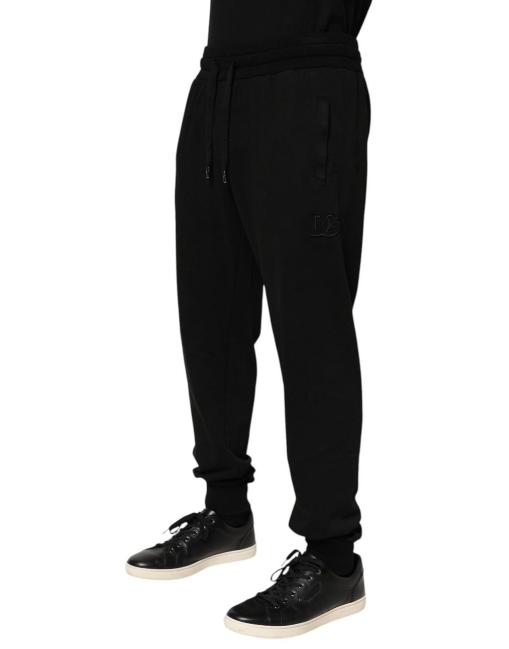 Pantalon jogging pour homme Dolce & Gabbana en coton noir avec logo DG, vue de face.