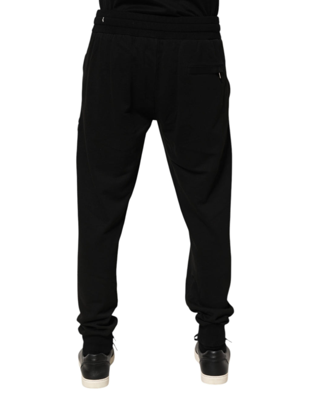 Pantalon jogger pour homme en coton noir Dolce & Gabbana avec logo DG visible, style décontracté et moderne.
