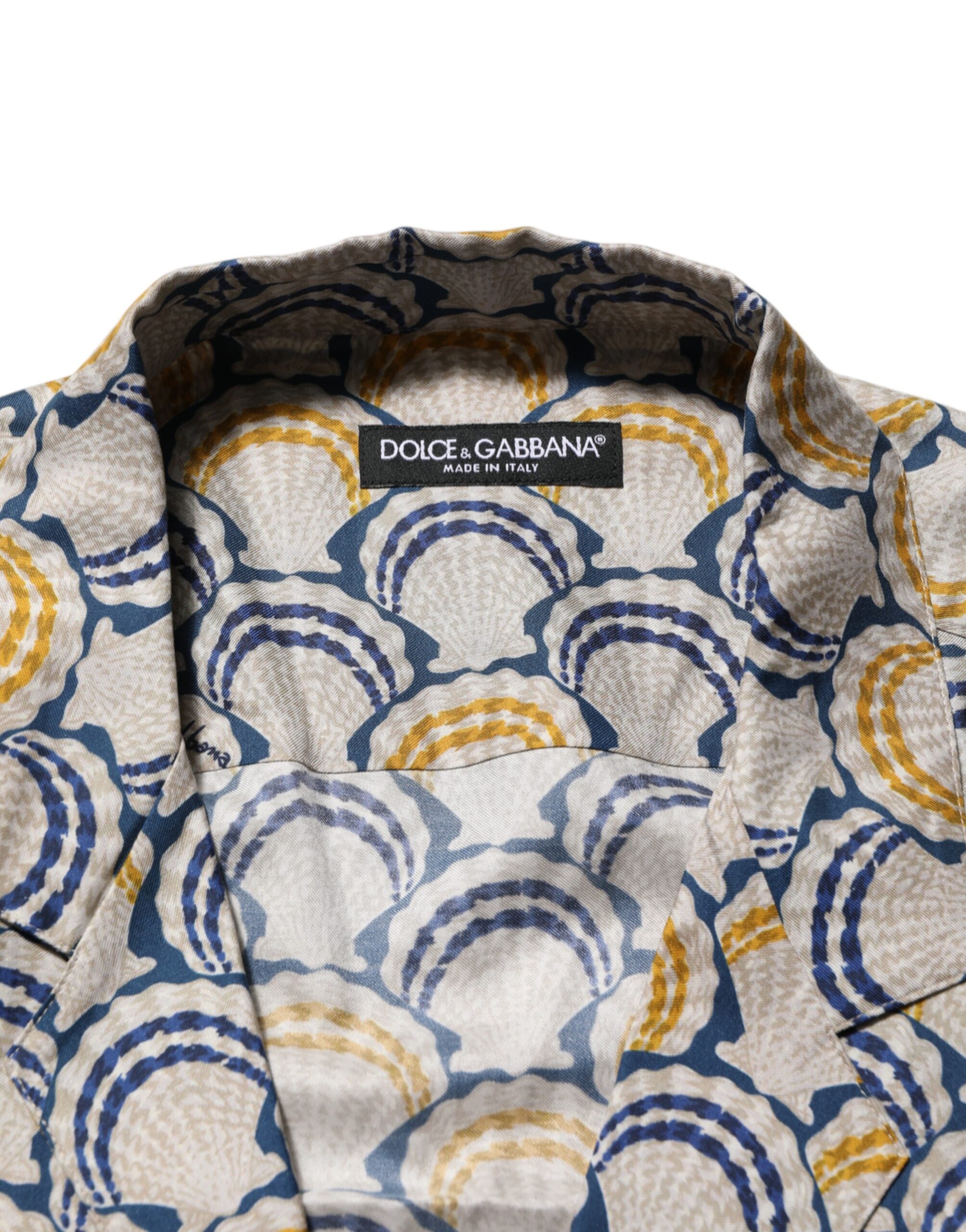 Chemise Dolce & Gabbana en coton et soie crème avec imprimé coquillage Hawaii à volants, vue de face.