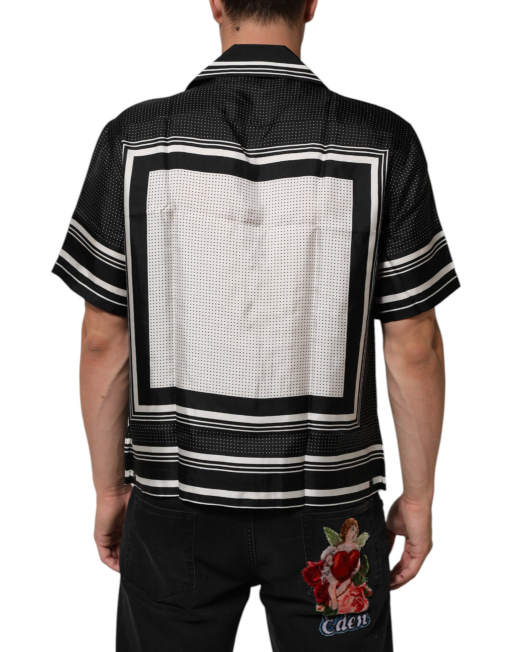 Chemise polo décontractée Dolce & Gabbana à rayures noires et blanches avec motif à pois, style élégant et confortable.