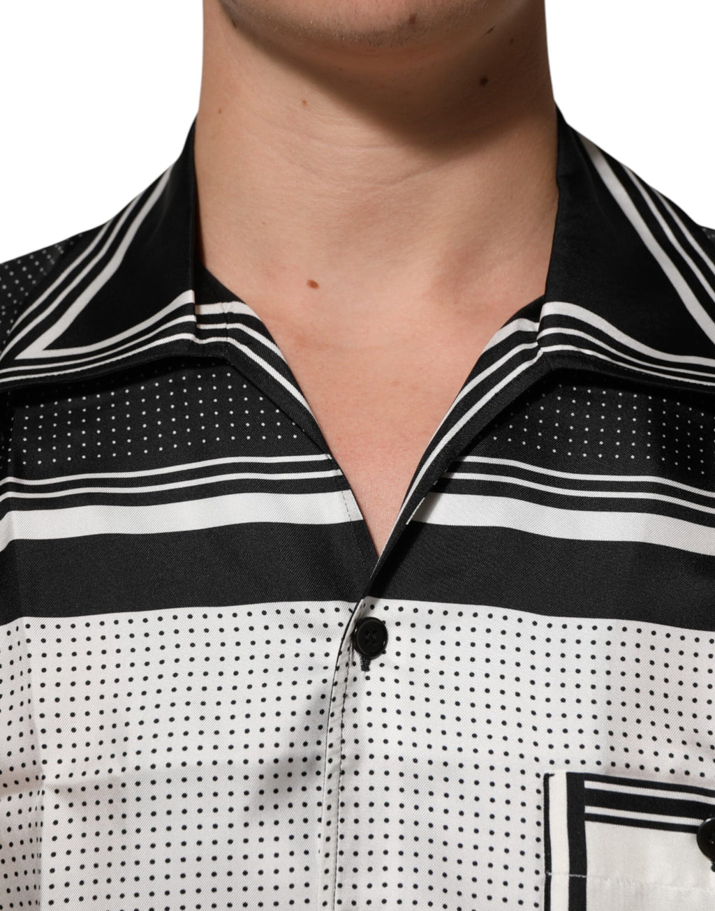 Chemise polo décontractée Dolce & Gabbana à rayures noires et blanches avec motif à pois, style élégant et casual.