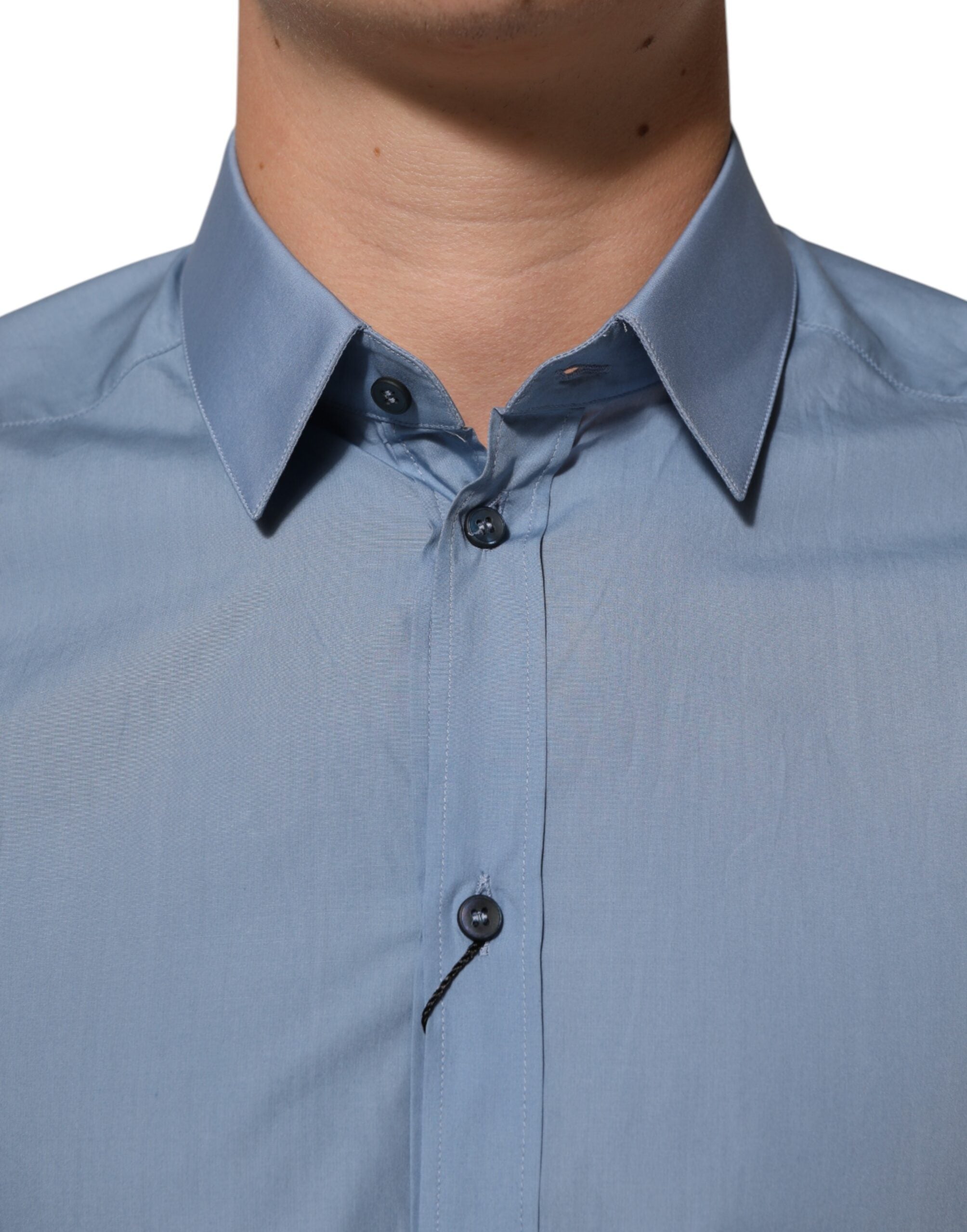 Chemise formelle Dolce & Gabbana en coton bleu avec col et détails dorés, pour homme élégante et sophistiquée.