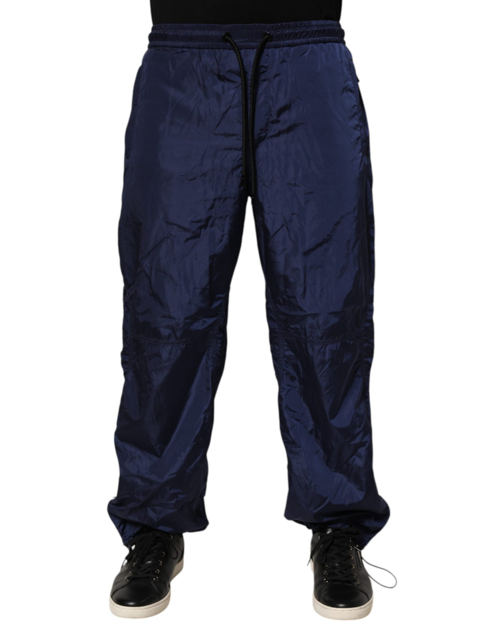 Pantalon de jogging en nylon bleu Dolce & Gabbana, coupe droite, avec poches et élastiques à la taille.