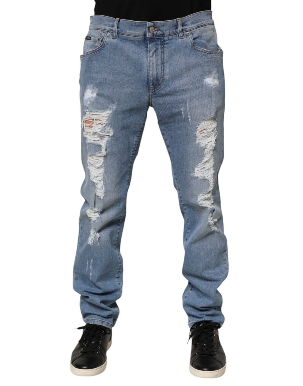 Jeans slim déchirés en denim en coton bleu de Dolce & Gabbana, coupe ajustée et détails usés.