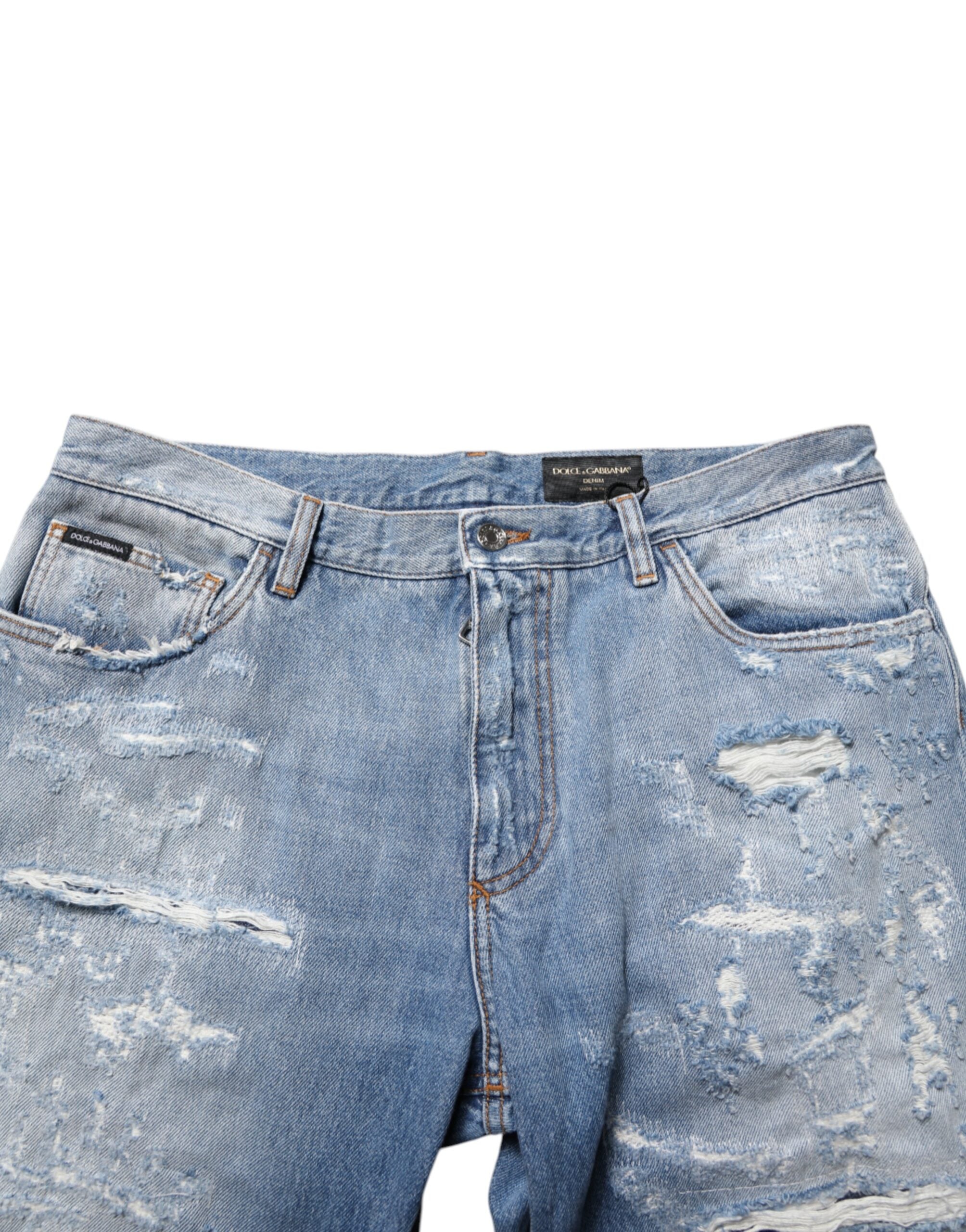 Pantalon en jean déchiré et délavé Dolce & Gabbana bleu, style distressed, coupe slim, denim tendance pour homme.