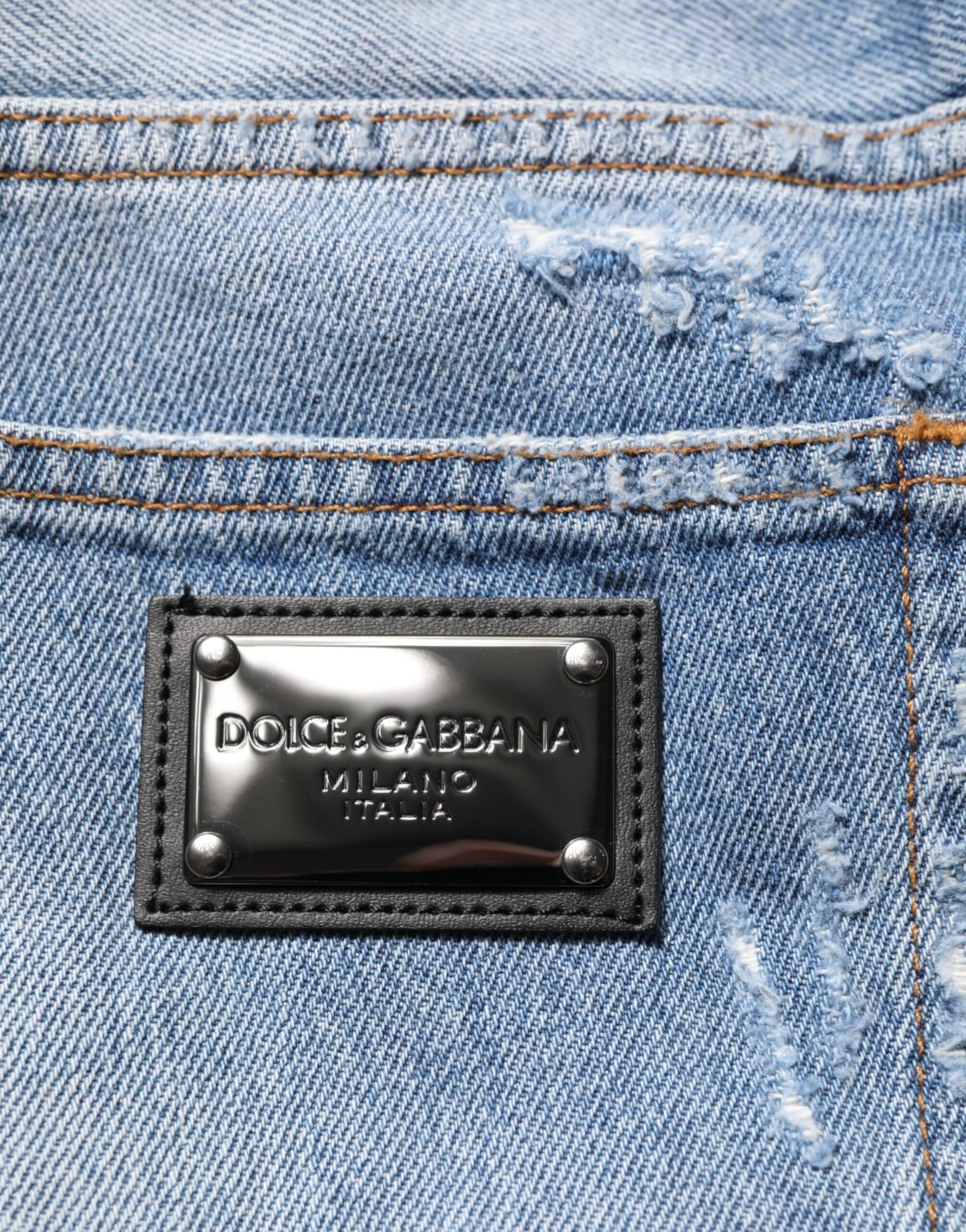 Pantalon en jean déchiré bleu Dolce & Gabbana avec détails décontractés et style distressed, vue de face.