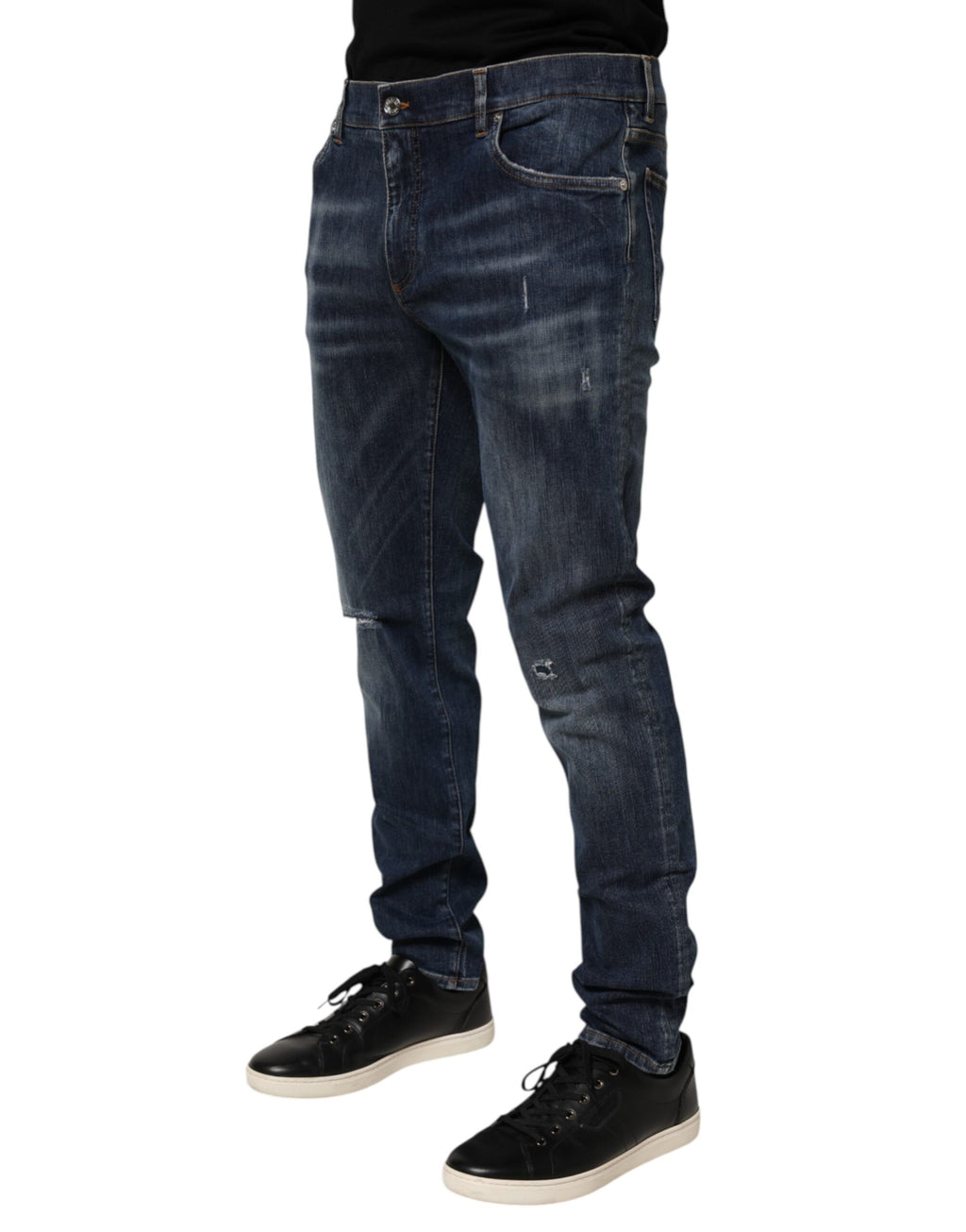 Jeans déchirés en denim bleu foncé Dolce & Gabbana, pantalon de course décontracté avec effet usé, style moderne et tendance.