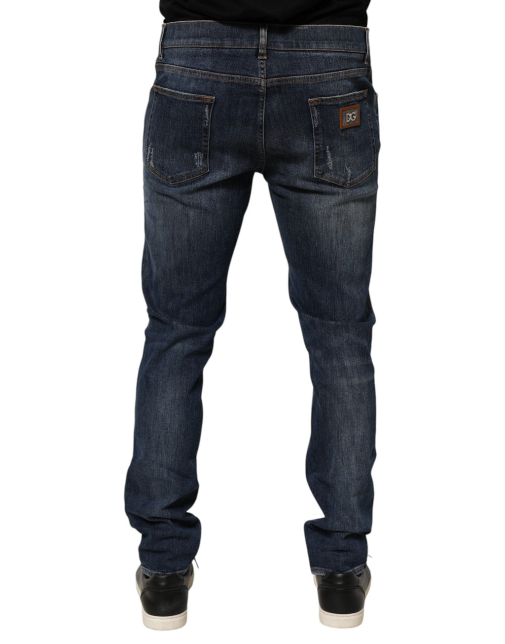 Jeans déchirés en denim bleu foncé de Dolce & Gabbana, style décontracté et usé, vue de face.