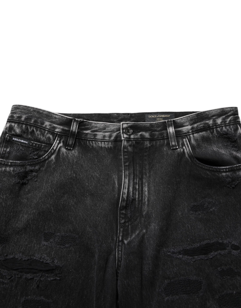 Jeans en coton délavé noir de Dolce & Gabbana, déchirés et amples, avec un style décontracté et tendance.