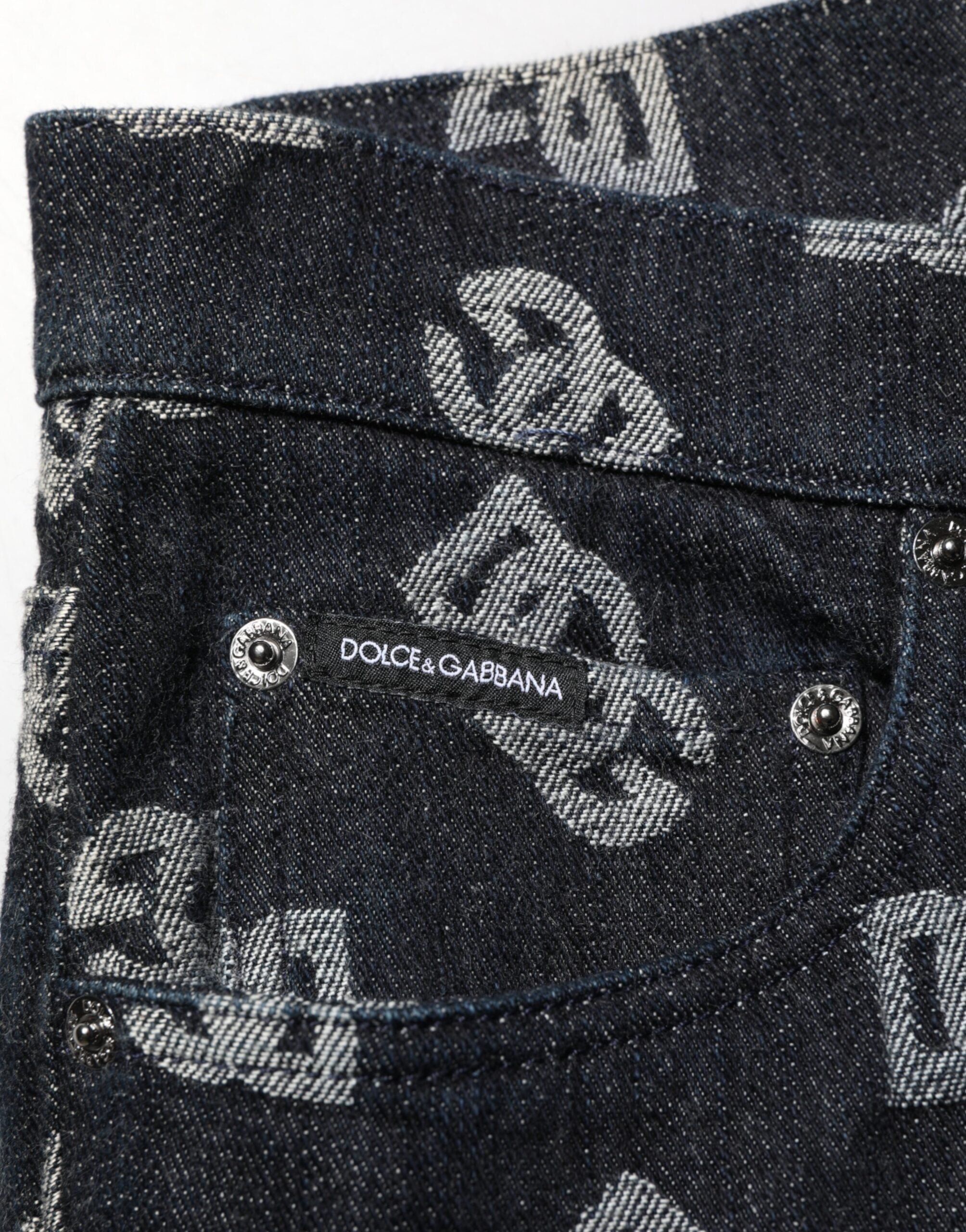 Jeans skinny en denim noir Dolce & Gabbana DG Monogram en coton, ajustés et modernes, visibles en gros plan.