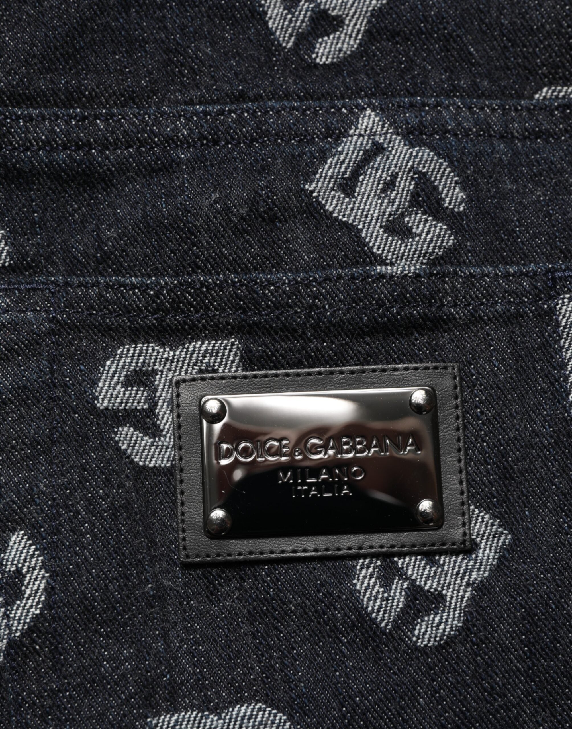 Jeans skinny en denim noir Dolce & Gabbana DG Monogram en coton, ajustés et élégants, visibles de face.