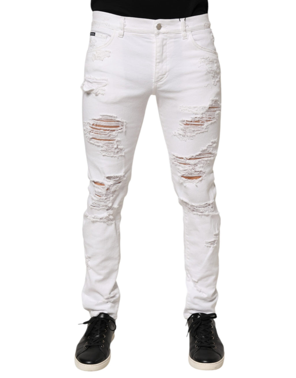 Pantalon en jean blanc déchiré et usé de Dolce & Gabbana, style décontracté avec détails distressed, pour femme ou homme.