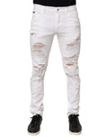 Pantalon en jean blanc déchiré et usé de Dolce & Gabbana, style décontracté avec détails distressed, pour femme ou homme.