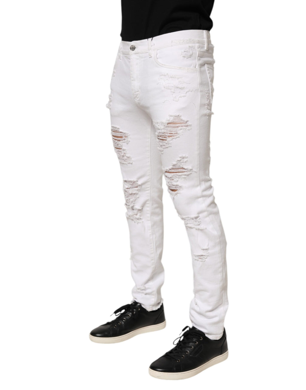 Jeans Dolce & Gabbana blanc déchiré et délavé, pantalon en denim distressed avec trou, style décontracté et tendance.