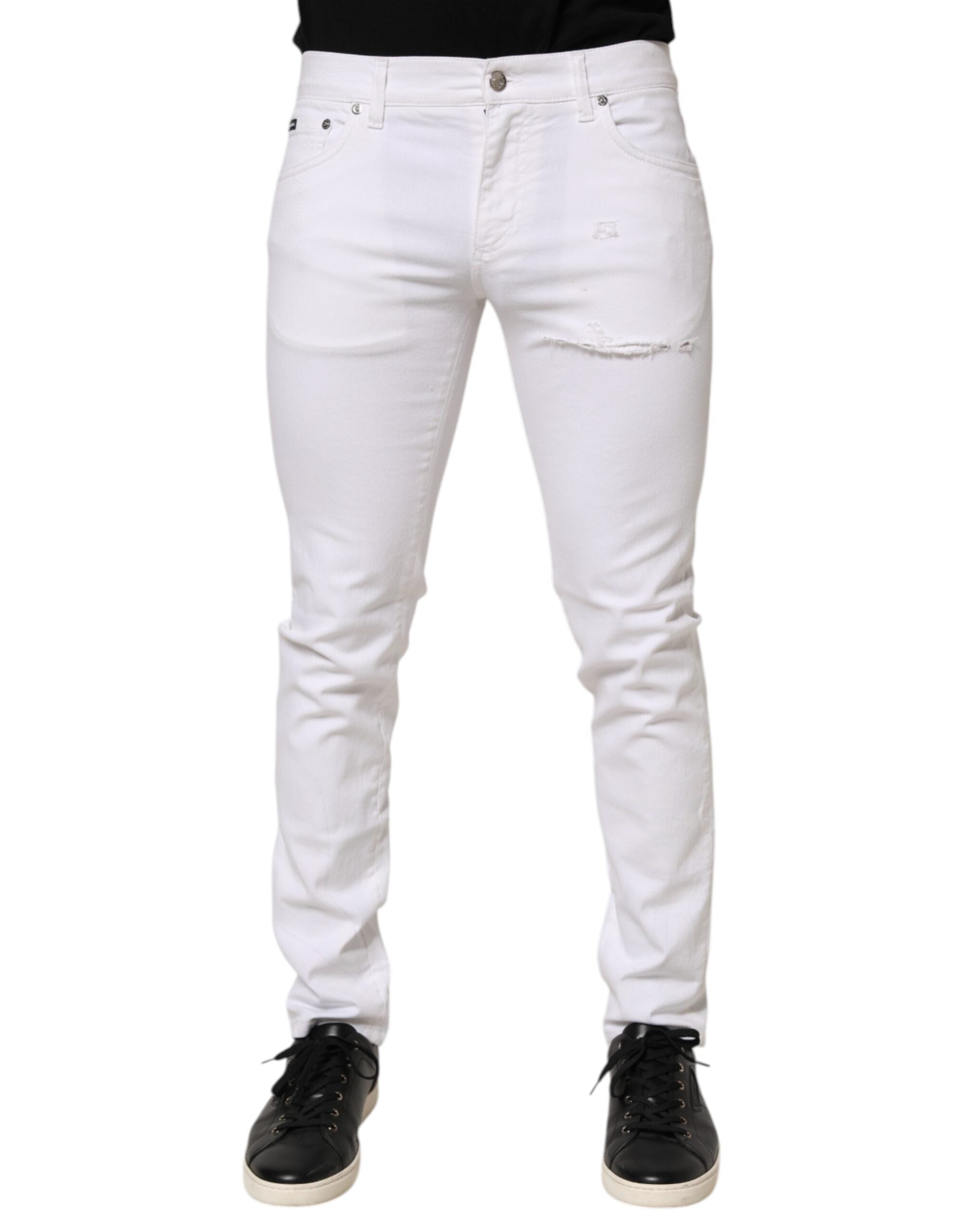 Jeans slim en coton blanc Dolce & Gabbana pour homme, avec déchirures et détails usés, style décontracté et tendance.