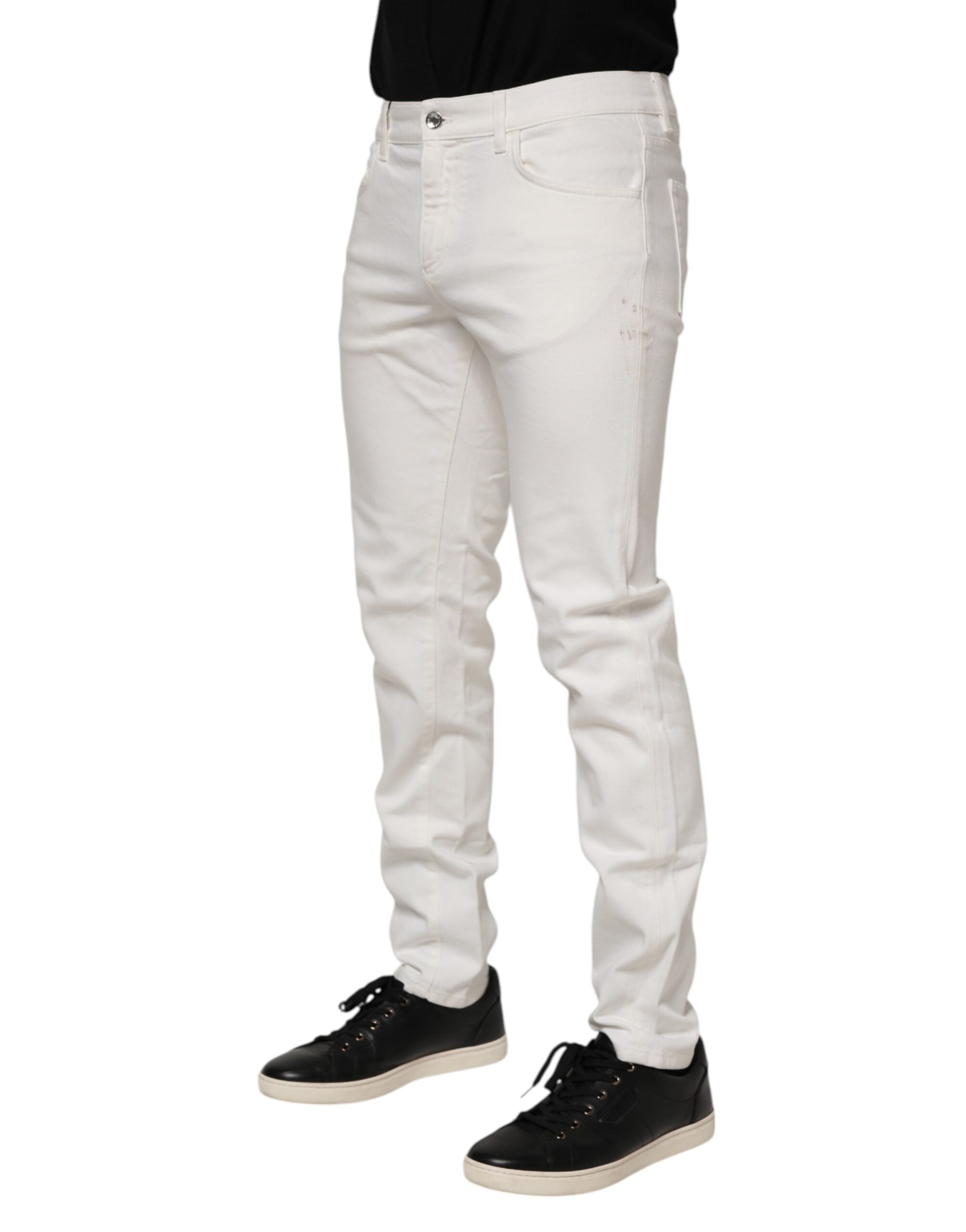 Jeans slim en coton stretch blanc cassé de Dolce & Gabbana, coupe ajustée et détails denim élégants.