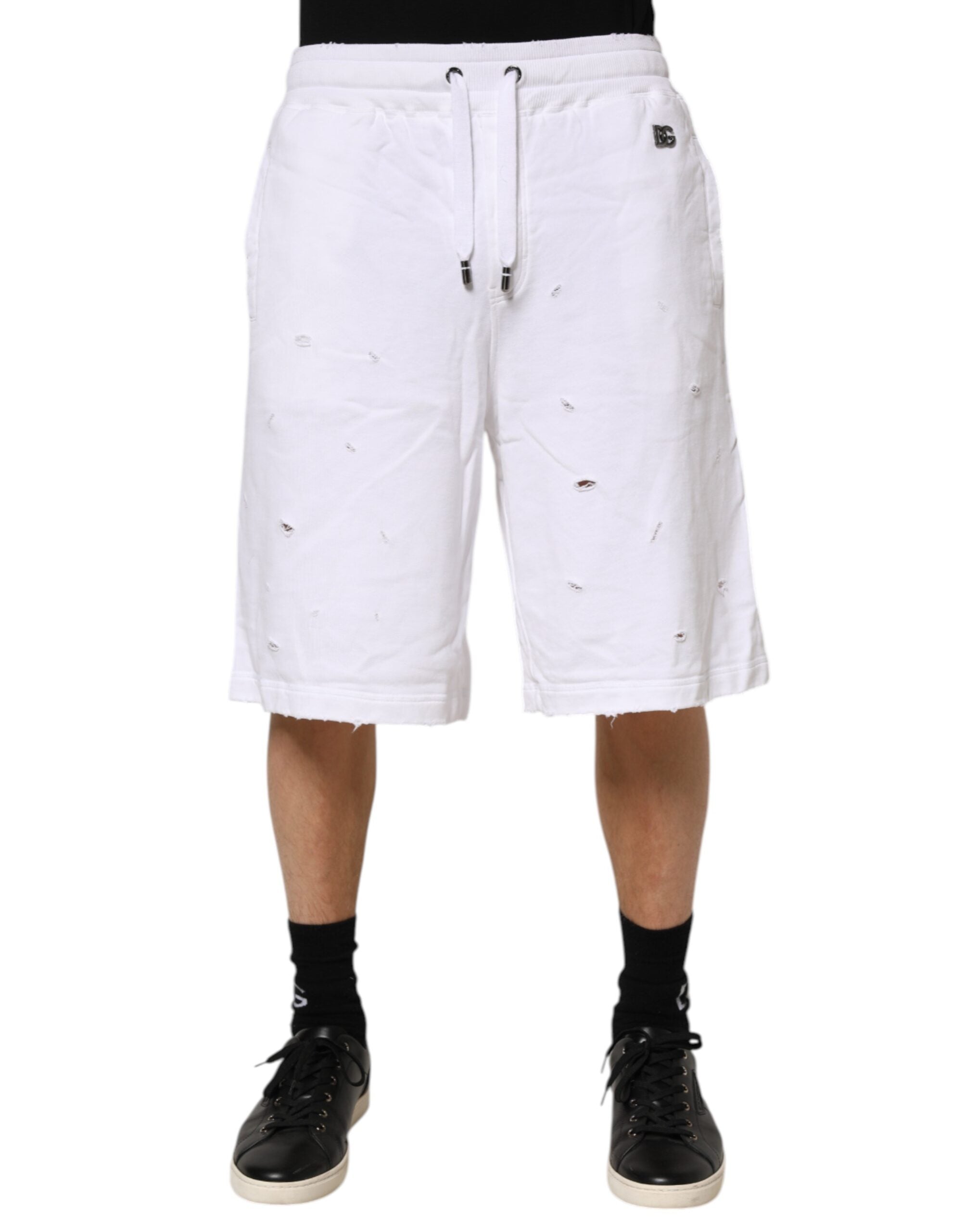 Shorts bermuda décontractés blancs Dolce & Gabbana taille mi-haute avec déchirures, style casual et tendance.