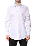 Chemise formelle blanche en coton Dolce & Gabbana avec col et détails dorés, élégante et sophistiquée, vue de face.