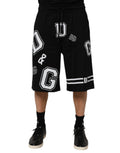 Shorts bermuda en coton noir Dolce & Gabbana avec logo imprimé, style décontracté et confortable, pour homme.