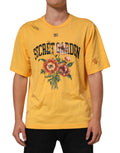 T-shirt à col rond en coton jaune avec motif floral Dolce & Gabbana Secret Garden, visible sur l'image.