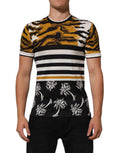 T-shirt homme Dolce & Gabbana à col rond, motif léopard multicolore avec feuilles de palmier, design élégant et coloré.