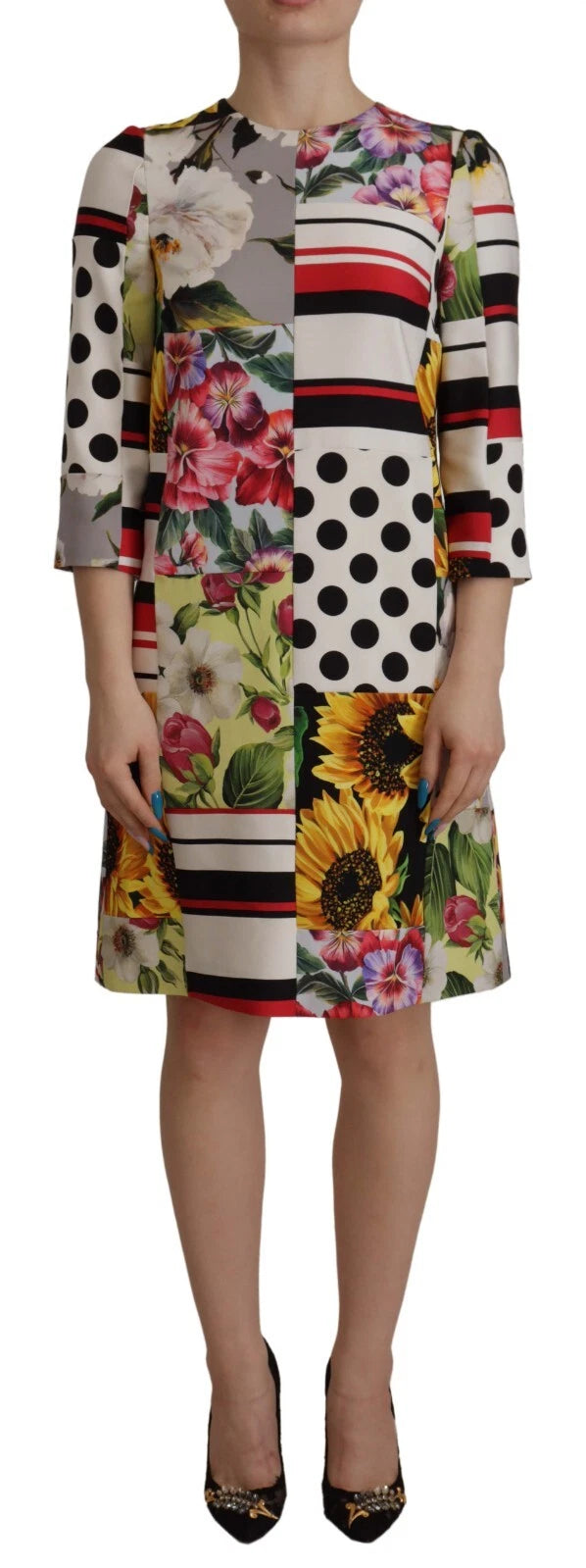 Robe de jour Dolce & Gabbana en soie charmeuse à motifs floraux multicolores et patchwork, coupe fluide et élégante.