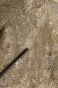 Robe courte Dolce & Gabbana en dentelle florale dorée, coupe évasée et silhouette élégante, vue de face.