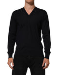 Pull en cachemire noir Dolce & Gabbana à col en V, pull-over élégant avec finition fine et texture douce visible.