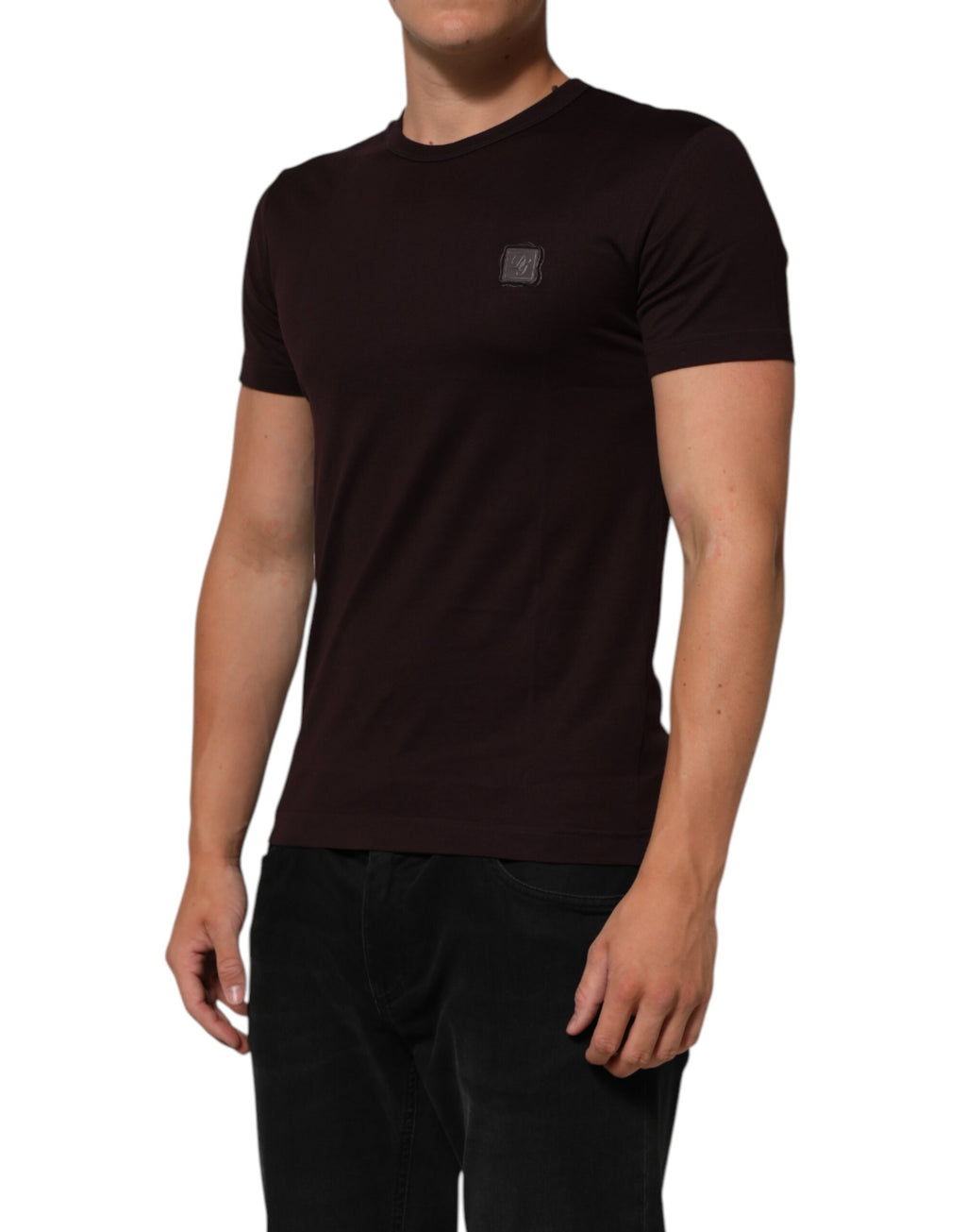 T-shirt en coton marron avec logo Dolce & Gabbana, col rond et plaque logo visible, style décontracté et élégant.