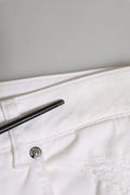 Jeans boyfriend en coton blanc Dolce & Gabbana avec déchirures et style décontracté, visibles en détail.