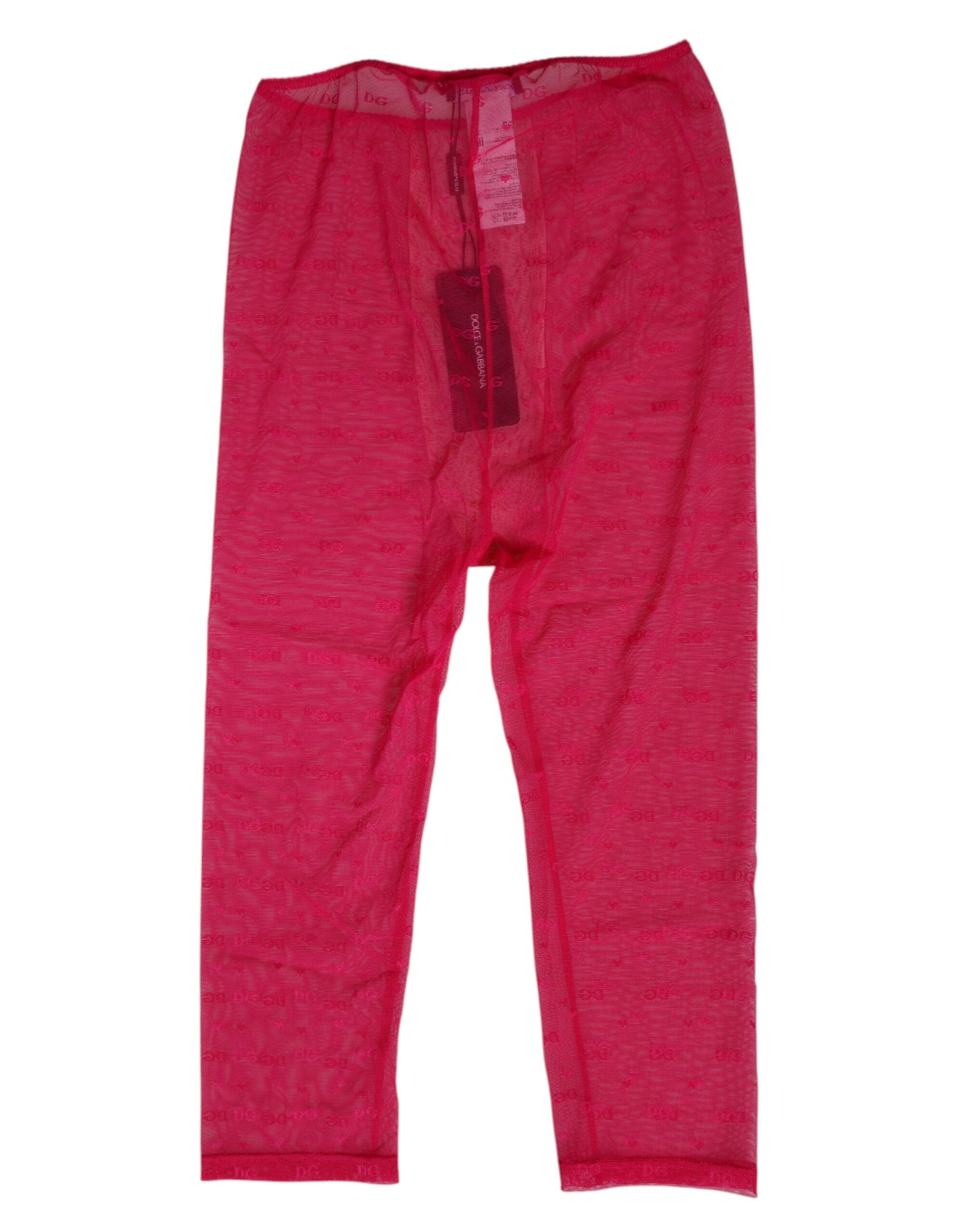 Sous-vêtements Dolce & Gabbana en dentelle rose fuchsia avec logo, coupe ajustée et mi-longue, visibles à l’image.