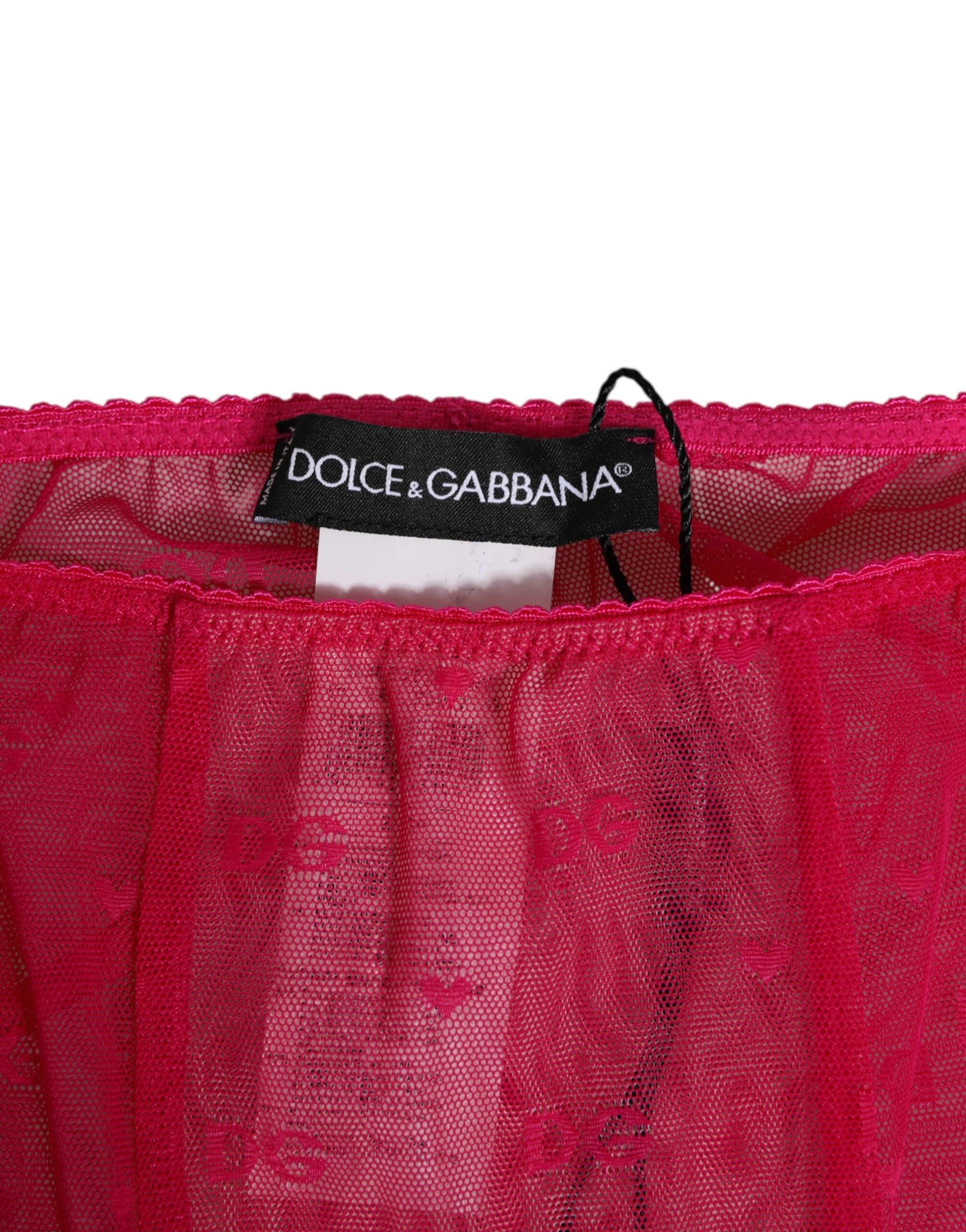 Sous-vêtements Dolce & Gabbana, corset midi en dentelle rose fuchsia avec logo, look élégant et sophistiqué.