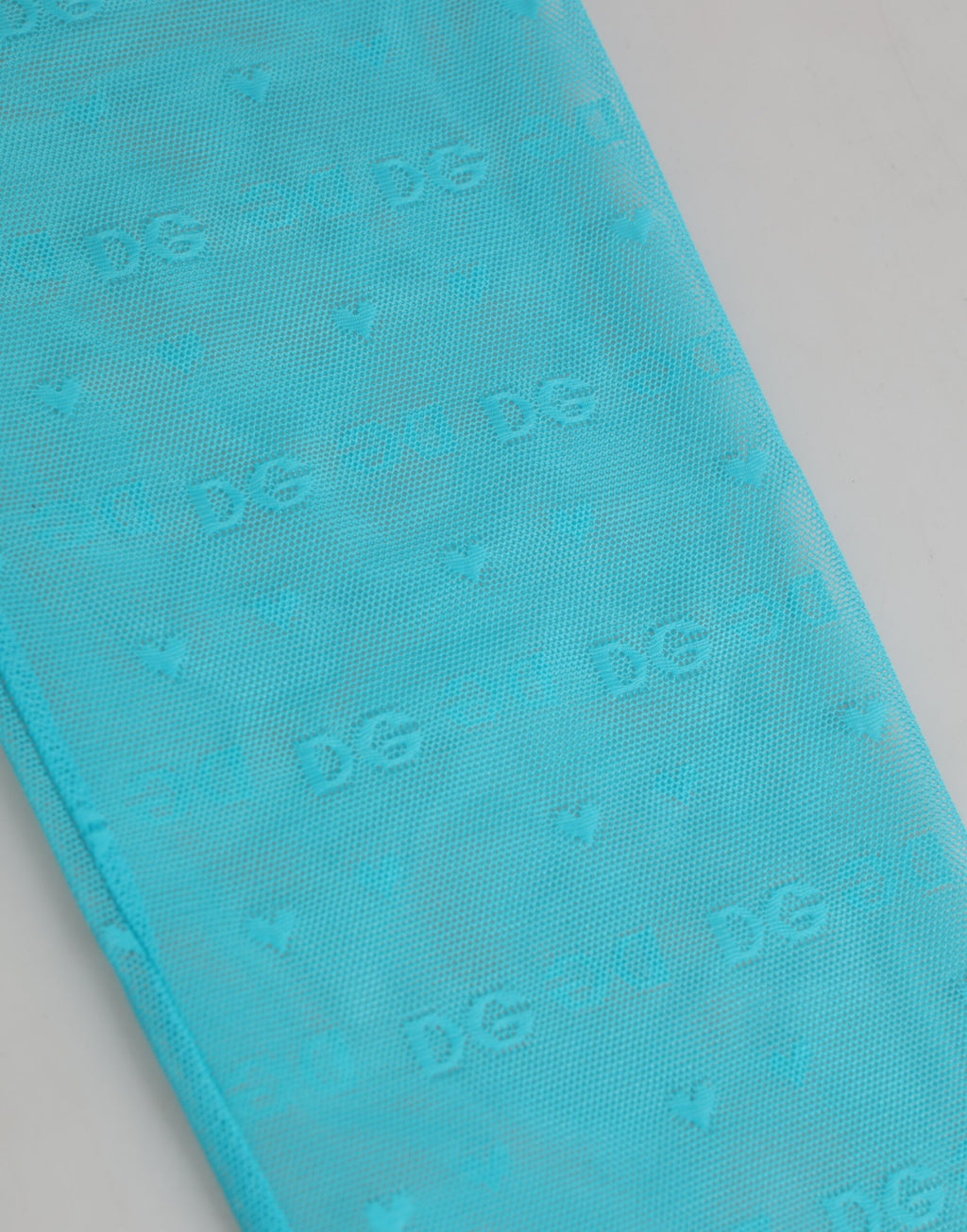 Leggings en nylon Dolce & Gabbana Light Blue avec logo en dentelle, coupe ajustée et détails élégants visible sur l'image.