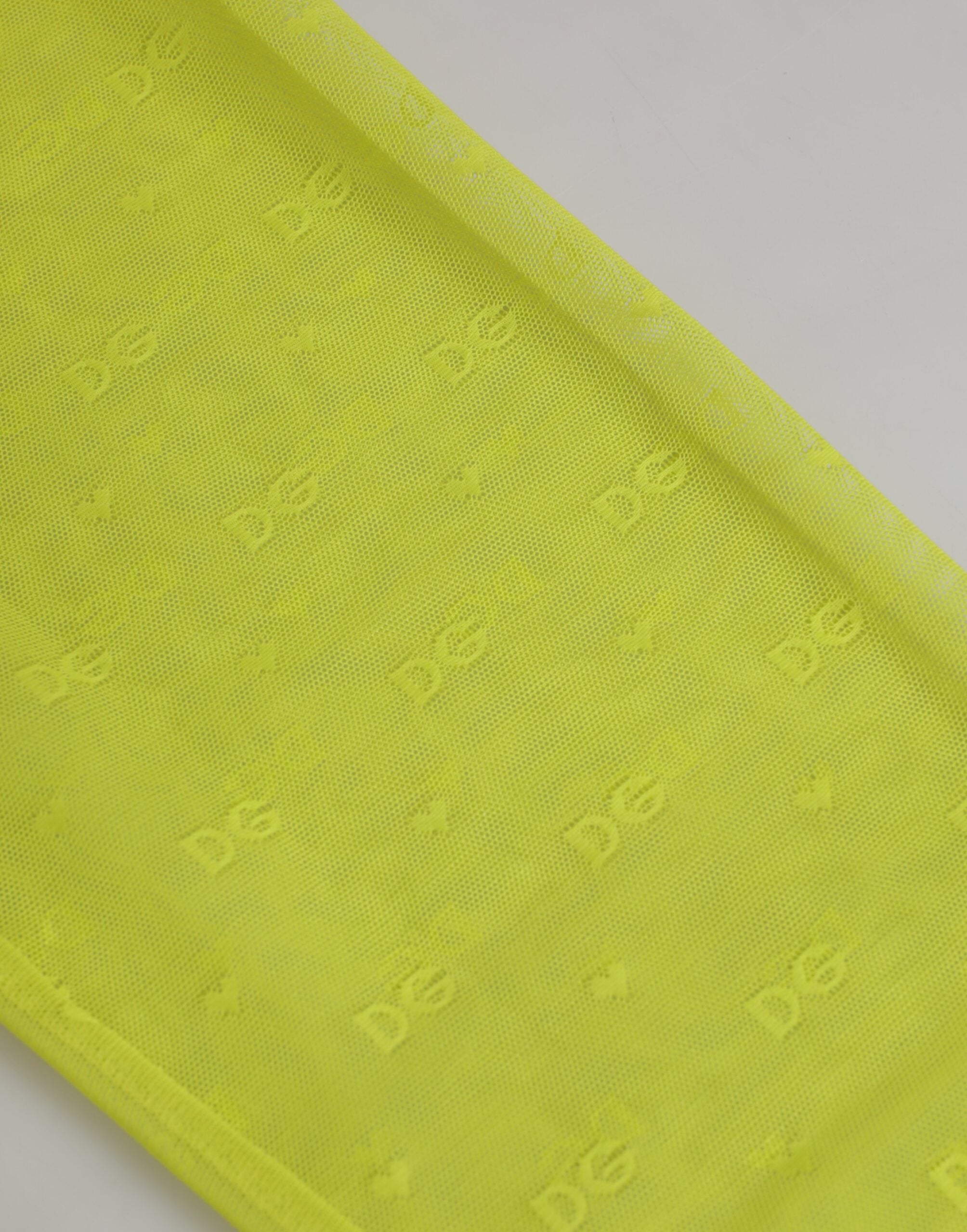 Leggings en nylon vert néon Dolce & Gabbana avec logo en dentelle, style élégant et moderne pour femme.