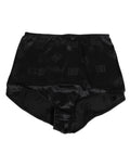 Garde-robe élégante : porte-jarretelle en soie noire Dolce & Gabbana avec taille haute et finition extensible.