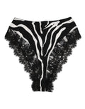 Sous-vêtements en soie noire Dolce & Gabbana avec motif zèbre, dentelle et taille haute, style élégant et sophistiqué.