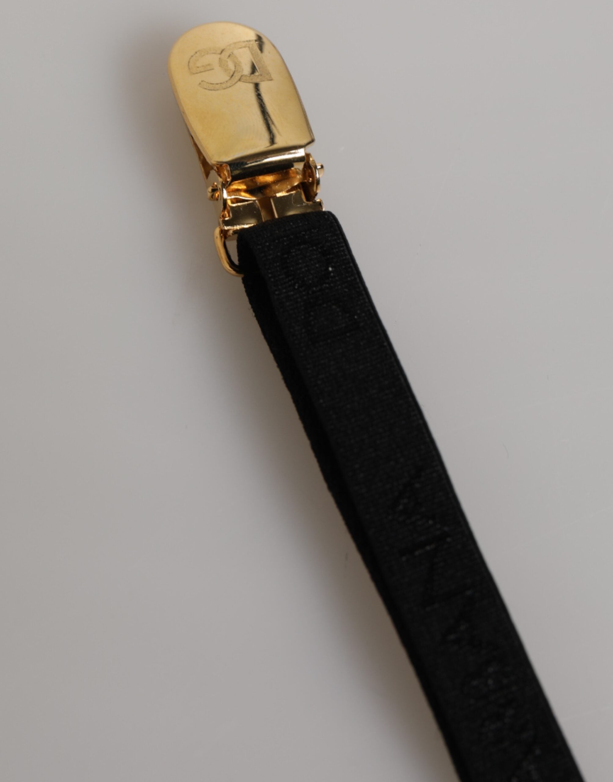 Garterie en dentelle florale noire de Dolce & Gabbana avec bretelles en nylon, élégante et sophistiquée.