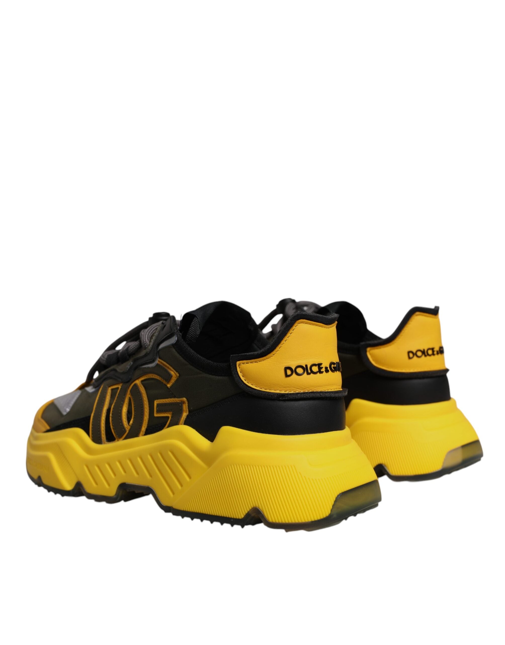 Chaussures Dolce & Gabbana Daymaster basses noires et jaunes, baskets en toile avec design élégant et moderne.