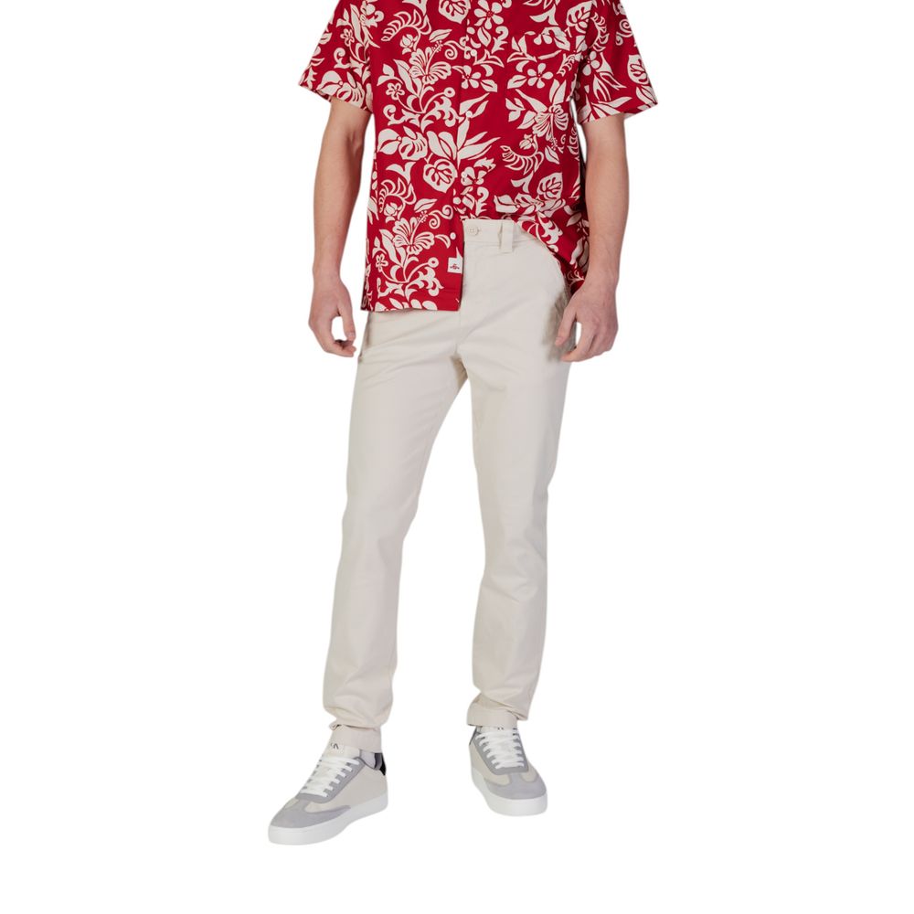 Pantalon skinny beige en coton de Tommy Hilfiger Jeans, coupe ajustée et tissu confortable, visible sur le modèle.