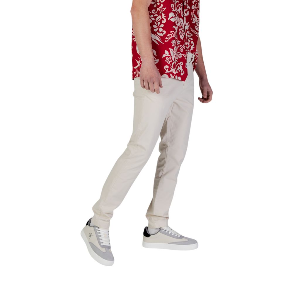Pantalons skinny Tommy Hilfiger en coton beige pour femmes, vue de face, en denim léger.
