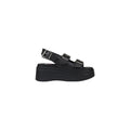 Sandales plateforme en cuir noir Tommy Hilfiger Jeans, avec bride à la cheville et semelle épaisse, pour un style tendance.