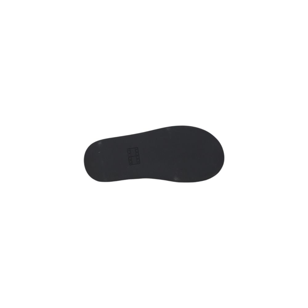 Sandales plateforme en cuir noir Tommy Hilfiger Jeans, avec semelle épaisse et design tendance visibles sur l'image.