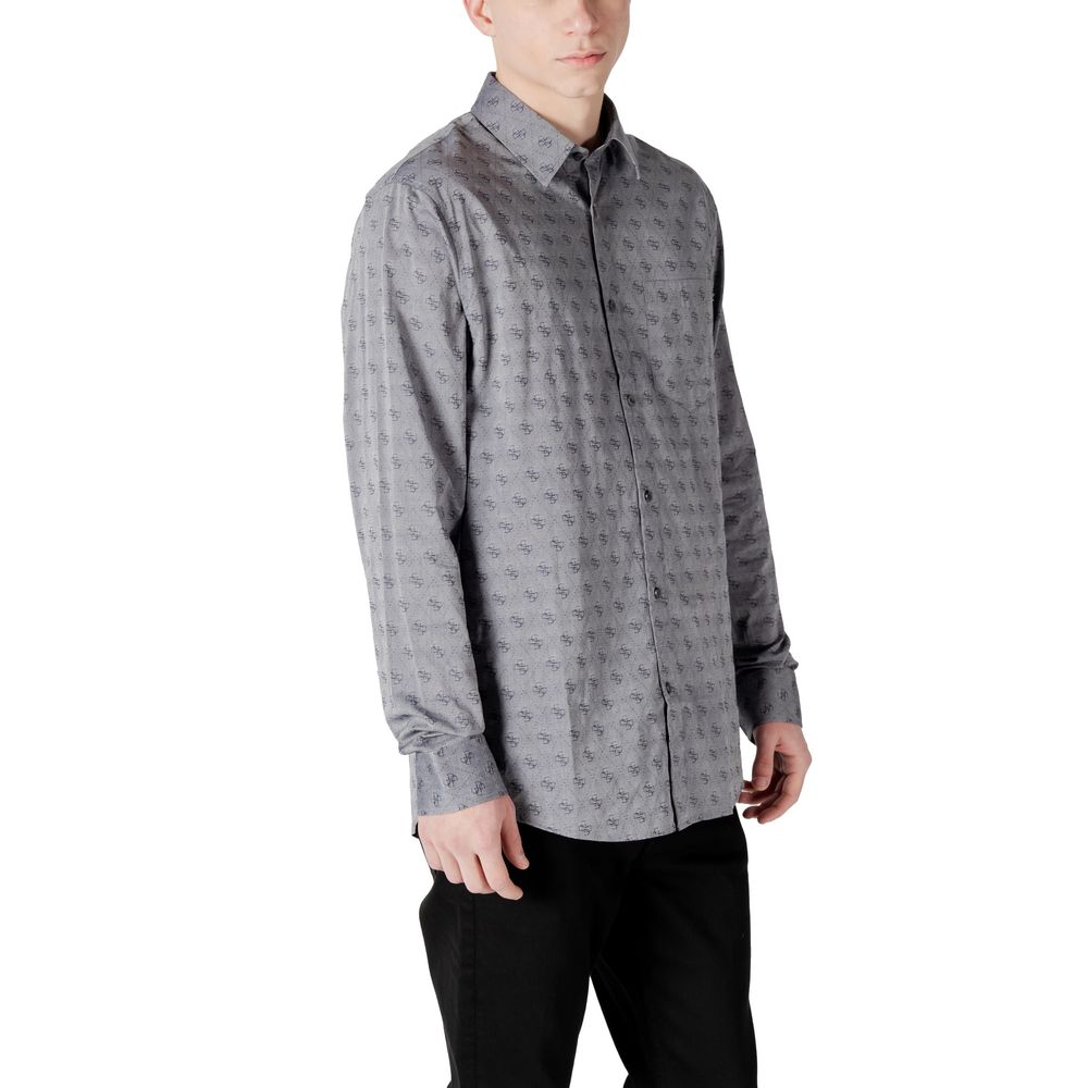 Chemise grise en coton de la marque Guess, coupe classique, col boutonné, manches longues, idéale pour un style élégant et décontracté.