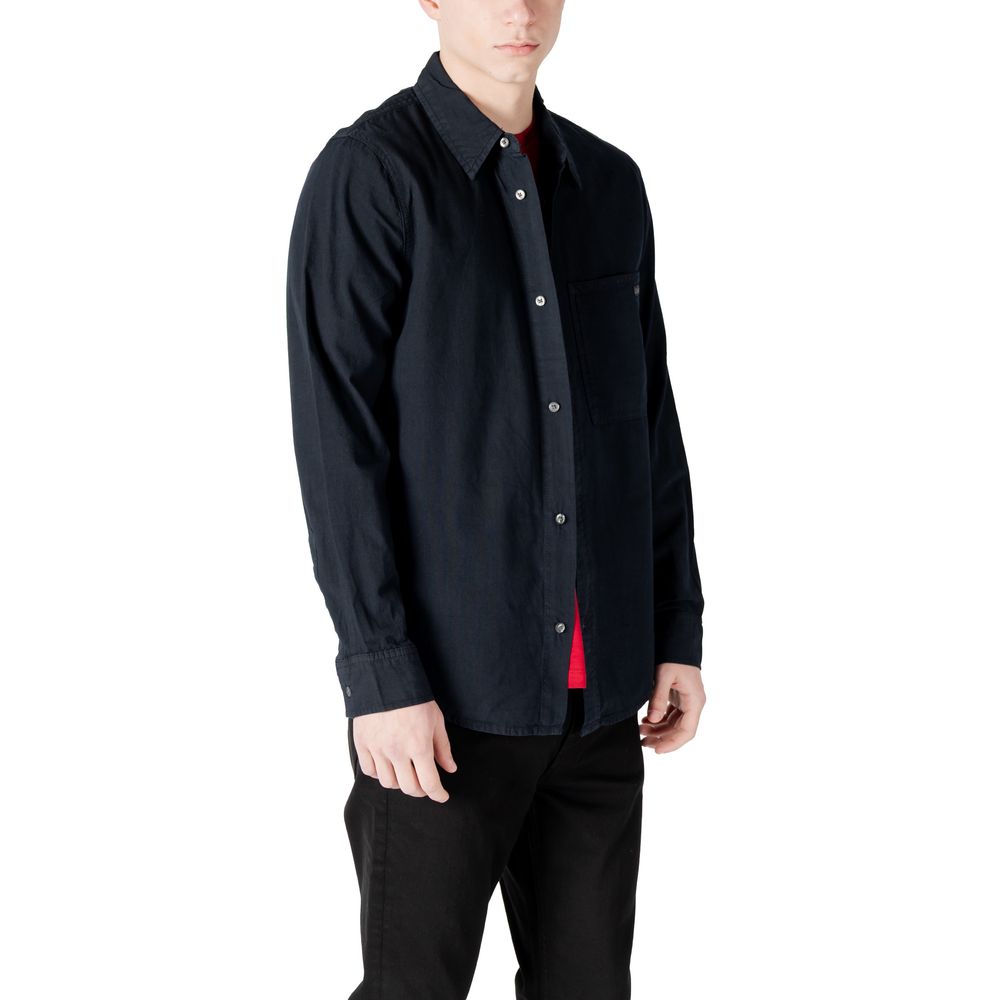 Chemise en coton noir Calvin Klein Jeans, coupe classique avec col et boutons, vue frontale.