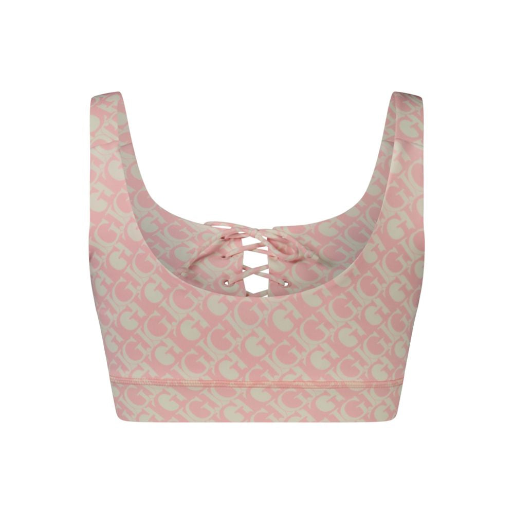 Chemise en polyester rose pour femme Guess Jeans, coupe décontractée, détails modernes, portée élégante, visible sur l'image.