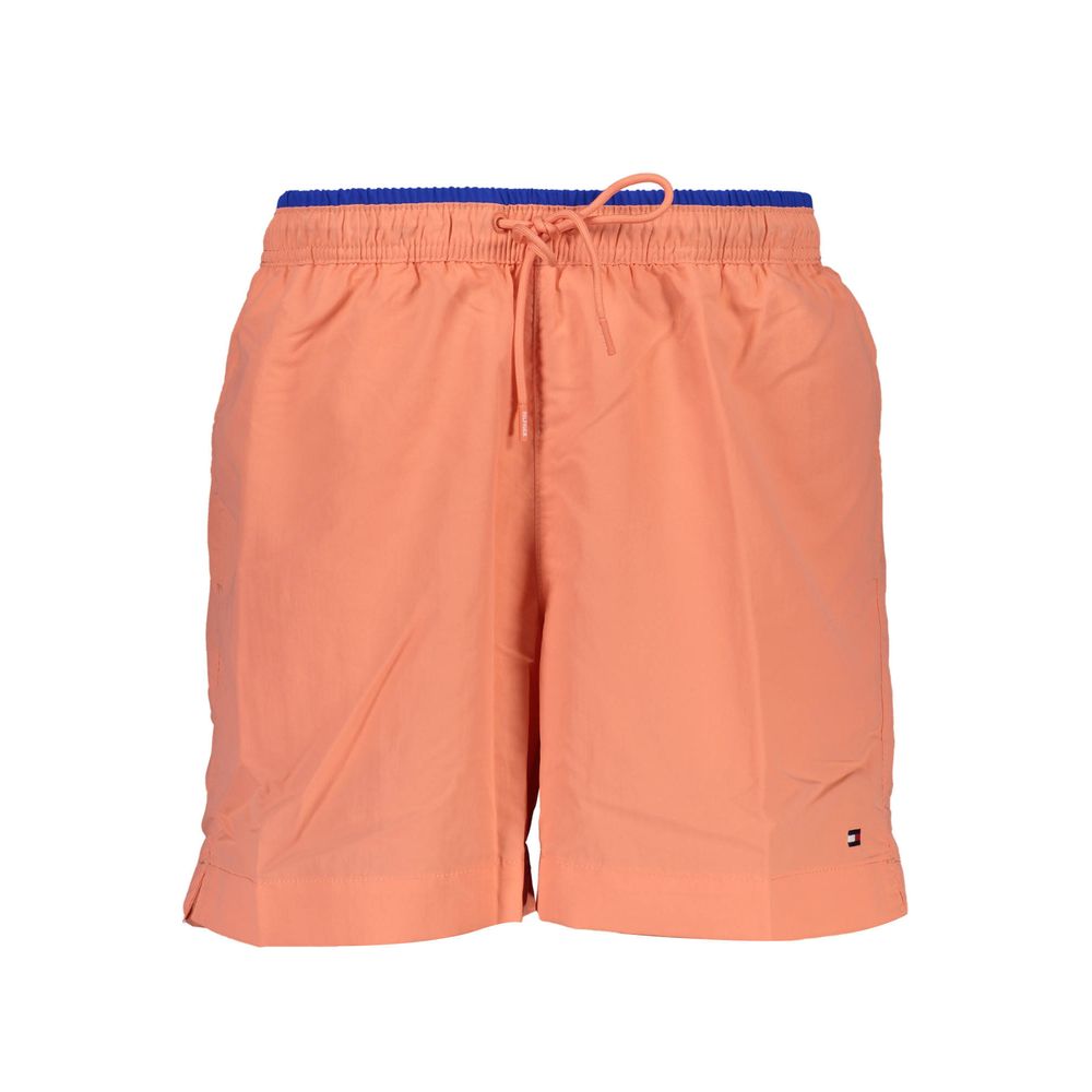 Maillot de bain homme Tommy Hilfiger en nylon rose, coupe confortable et style sportif pour la plage.