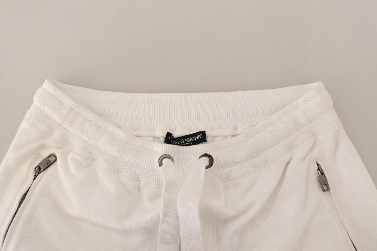 Pantalon de jogging Dolce & Gabbana en coton blanc avec logo brodé, style décontracté et confortable.